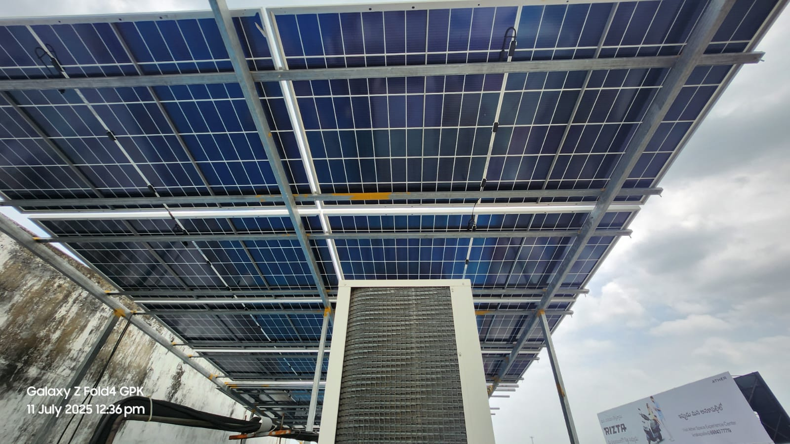 Sky Solar Client Standing with Installed Panels